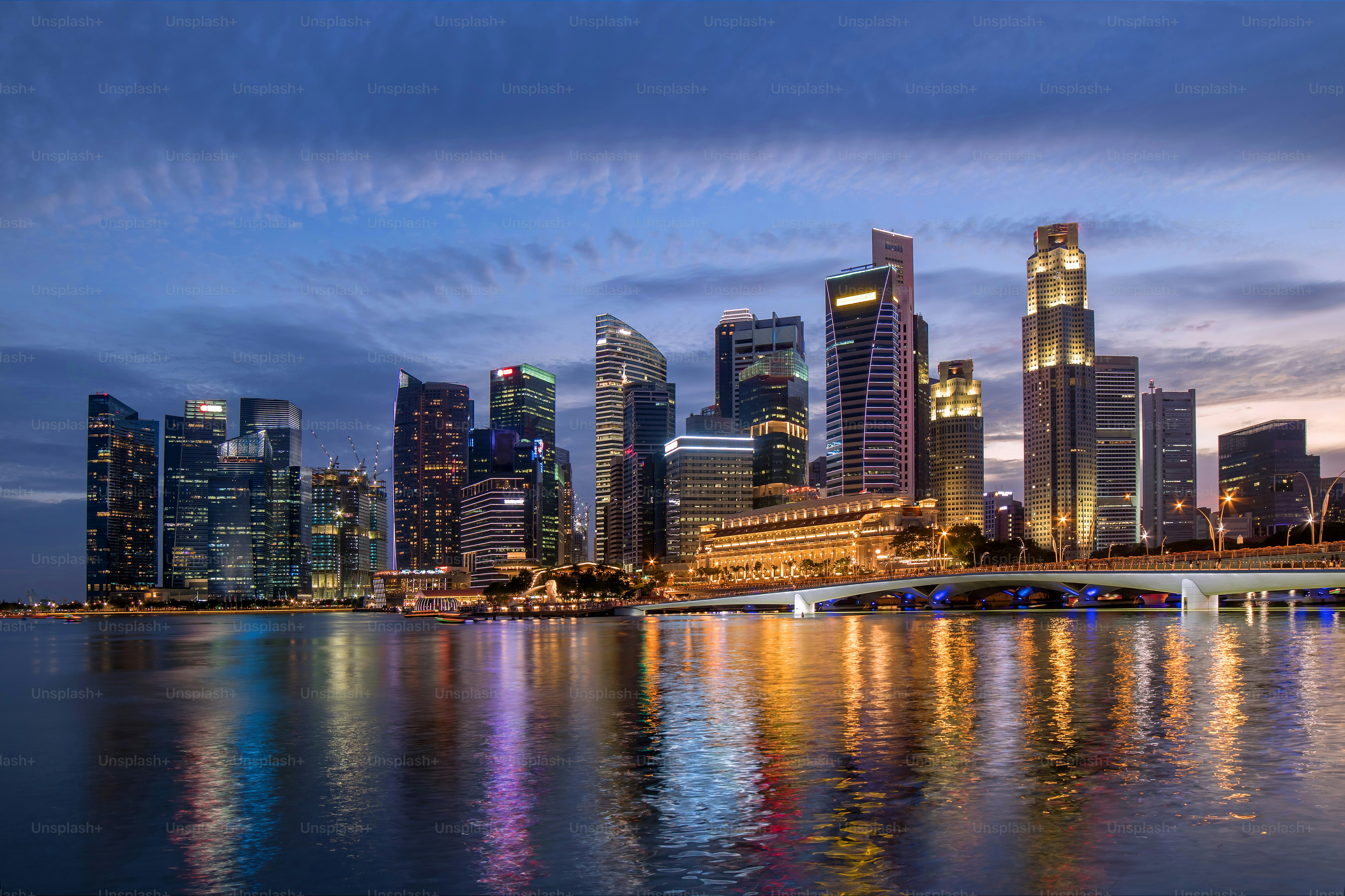Colorful Singapore business district skyline after sun set at Marina Bay.